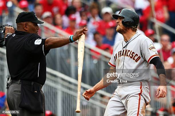 Hunter Pence of the San Francisco Giants reacts after scoring on a single by Brandon Belt in the fourth inning against the Washington Nationals...