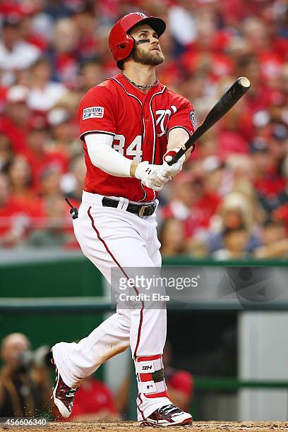 Bryce Harper of the Washington Nationals hits a home run in the seventh inning against the San Francisco Giants during Game One of the National...