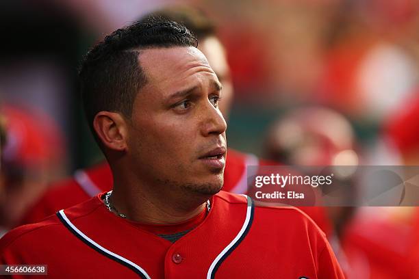 Asdrubal Cabrera of the Washington Nationals celebrates his in the seventh inning home run with teammates during Game One of the National League...