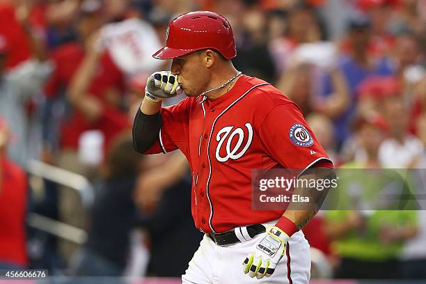 Asdrubal Cabrera of the Washington Nationals celebrates his in the seventh inning home run during Game One of the National League Division Series...