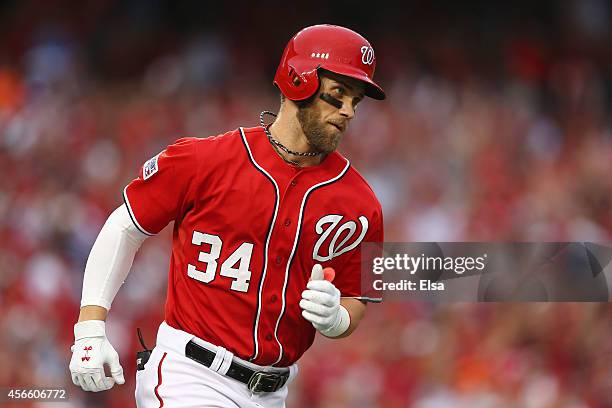 Bryce Harper of the Washington Nationals rounds the bases after hitting a home run in the seventh inning against the San Francisco Giants during Game...