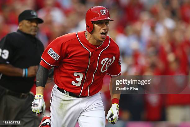 Asdrubal Cabrera of the Washington Nationals reacts to his seventh inning home run during Game One of the National League Division Series against the...