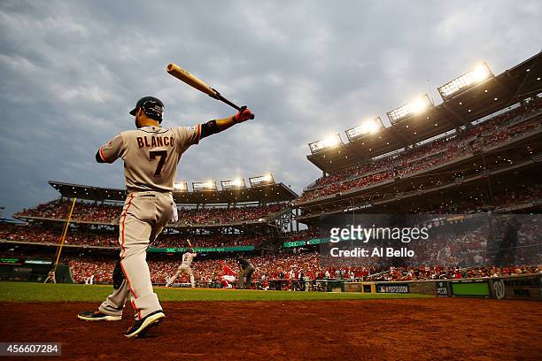 Gregor Blanco of the San Francisco Giants stands on deck during Game One of the National League Division Series against the Washington Nationals at...