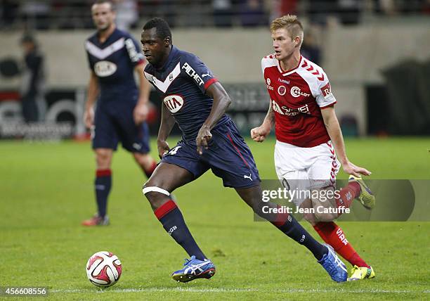 Cheick Diabate of Bordeaux and Gaetan Charbonnier of Stade de Reims in action during the French Ligue 1 match between Stade de Reims and FC Girondins...