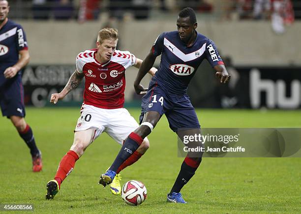 Cheick Diabate of Bordeaux and Gaetan Charbonnier of Stade de Reims in action during the French Ligue 1 match between Stade de Reims and FC Girondins...