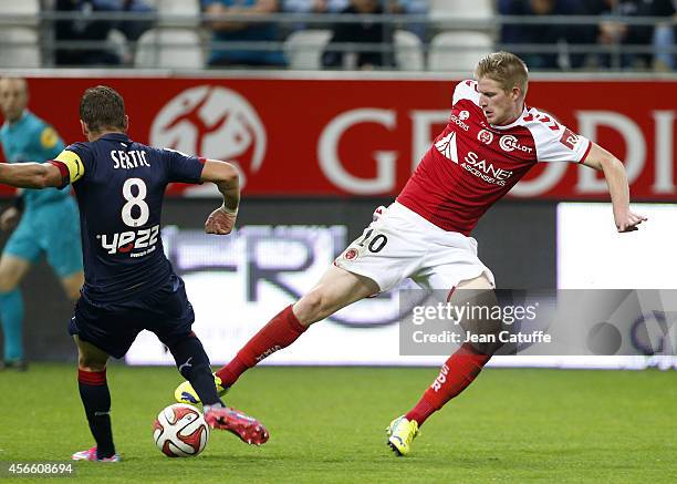 Gaetan Charbonnier of Stade de Reims in action during the French Ligue 1 match between Stade de Reims and FC Girondins de Bordeaux at the Stade...
