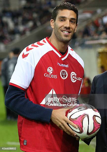Track and field champion born in Reims Mahiedine Mekhissi kicks off the French Ligue 1 match between Stade de Reims and FC Girondins de Bordeaux at...