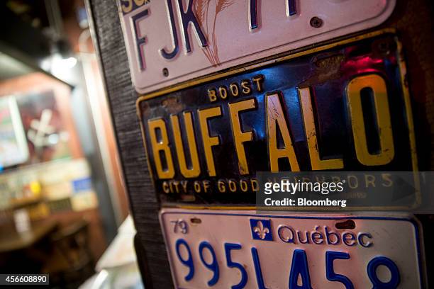 Buffalo license plate hangs on a wall at the Anchor Bar in Buffalo, New York, U.S., on Wednesday, Sept. 24, 2014. The Federal Reserve Bank of New...