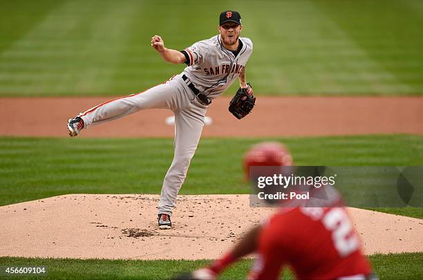 Jake Peavy of the San Francisco Giants pitches in the first inning against the Washington Nationals during Game One of the National League Division...