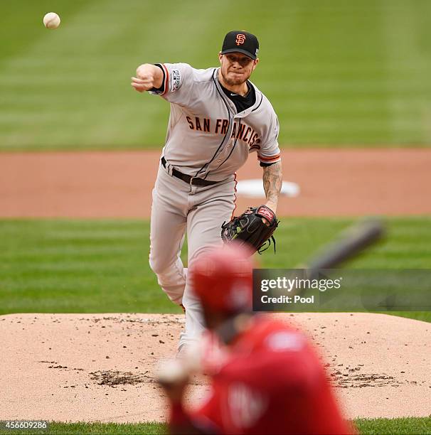 Jake Peavy of the San Francisco Giants pitches in the first inning against the Washington Nationals during Game One of the National League Division...