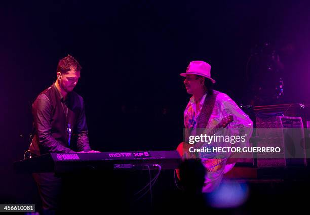 Mexican musician Carlos Santana and his son Salvador Santana perform during the Santana and Special Guests concert in Guadalajara on December 14,...