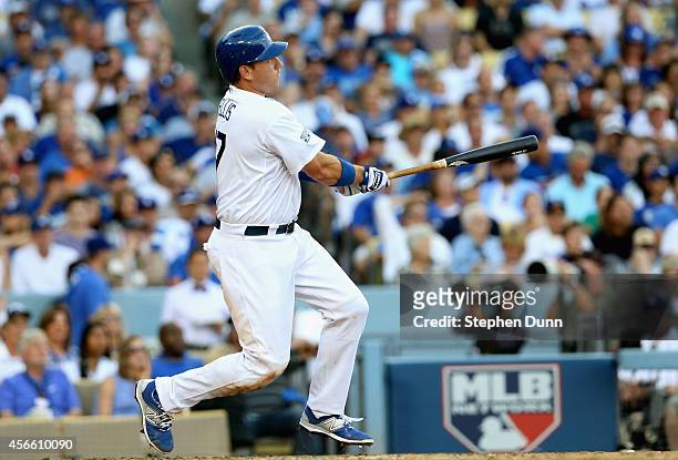 Ellis of the Los Angeles Dodgers hits a two-run homerun in the fifth inning against the St. Louis Cardinals during Game One of the National League...