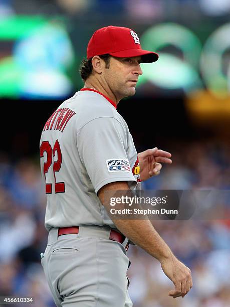 Manager Mike Matheny outfield the St. Louis Cardinals calls for a new pitcher in the fifth inning of Game One of the National League Division Series...