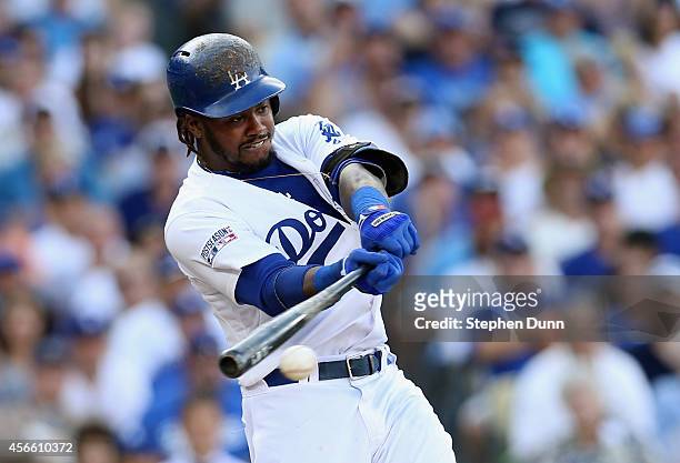 Hanley Ramirez of the Los Angeles Dodgers singles to knock in Yasiel Puig in the third inning of Game One of the National League Division Series at...