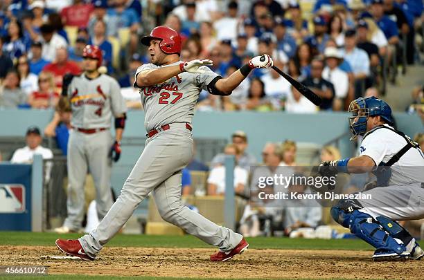 Jhonny Peralta outfield the St. Louis Cardinals hits a single in the seventh inning against the Los Angeles Dodgers during Game One of the National...