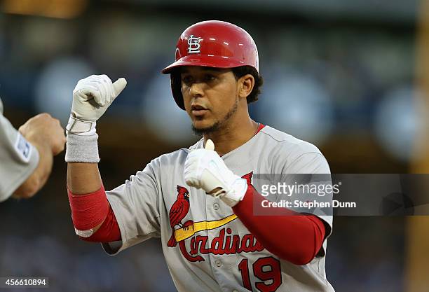 Jon Jay of the St. Louis Cardinals celebrates after his RBI single to score teammate Jhonny Peralta in the seventh inning against the Los Angeles...