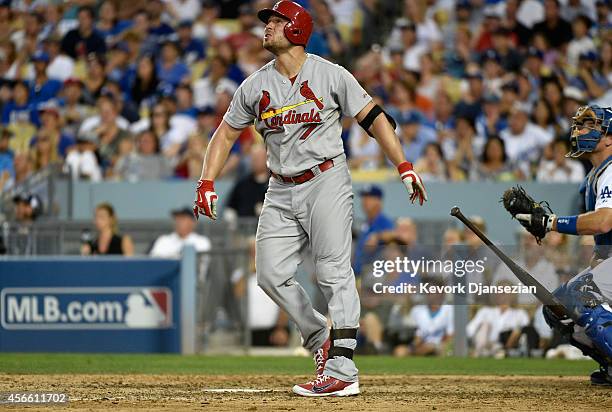 Matt Holliday of the St. Louis Cardinals hits a three run homerun in the seventh inning during Game One of the National League Division Series at...