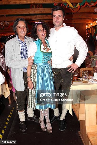 Hans-Wilhelm Mueller-Wohlfahrt and his wife Karin Mueller - Wohlfahrt and their son Dr. Kilian Mueller Wohlfahrt during Oktoberfest at...