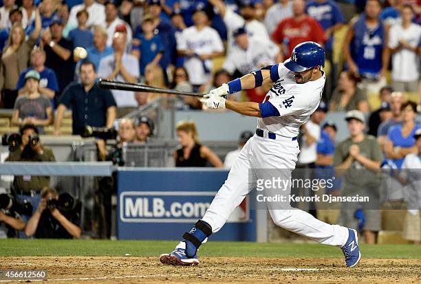 Andre Ethier of the Los Angeles Dodgers hits a a double in the ninth inning against the St. Louis Cardinals during Game One of the National League...