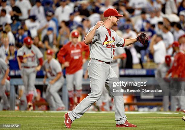 Closing pitcher Trevor Rosenthal of the St. Louis Cardinals celebrates after Yasiel Puig of the Los Angeles Dodgers strikes out in the ninth inning...