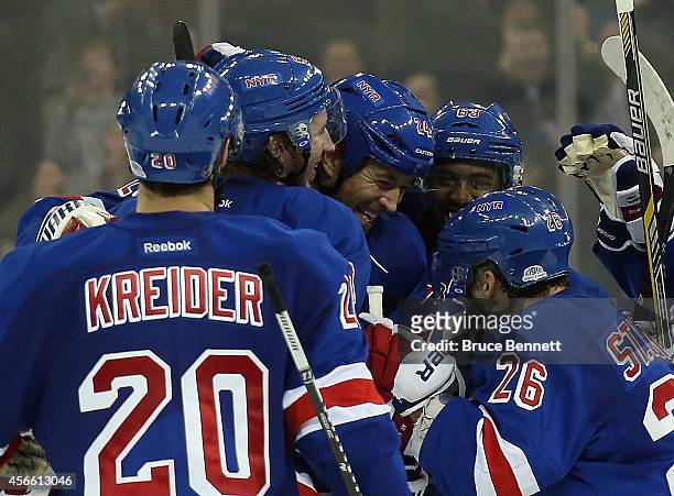 Ryan Malone of the New York Rangers celebrates his game winning shootout goa against the Chicago Blackhawks at Madison Square Garden on October 3,...