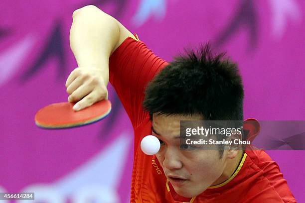 Fan Zhendong of China serves a shot to Chuang Chih Yuan of Chinese Taipei during the Men's Semi Final match during the day fifteen of the 2014 Asian...