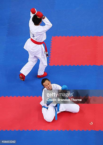 Tsui Ping Ku of Chinese Taipei celebrates victory as Yee Ting Tsang of Hong Kong shows her dejection following the Women's -50kg Semi Final during...