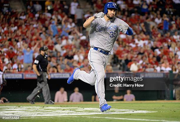 Eric Hosmer of the Kansas City Royals rounds the bases after hitting a two-run home run in the eleventh inning against the Los Angeles Angels during...