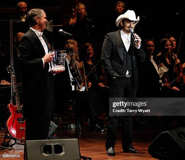 Brad Paisley receives the Harmony award from Senator Bill Frist at the 29th annual Symphony Ball at Schermerhorn Symphony Center on December 14, 2013...
