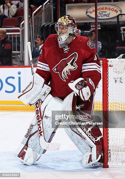 Goatlender Mike Smith of the Phoenix Coyotes in action during the NHL game against the New York Islanders at Jobing.com Arena on December 12, 2013 in...