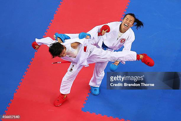 Tsui Ping Ku of Chinese Taipei competes against Yee Ting Tsang of Hong Kong in the Women's -50kg Semi Final during day fifteen of the 2014 Asian...