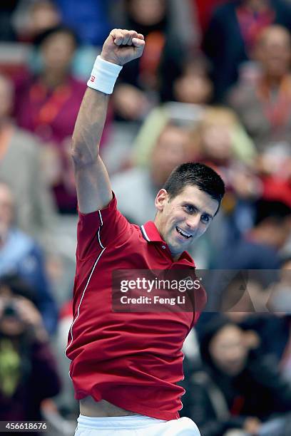 Novak Djokovic of Serbia celebrates winning his semifinal match against Andy Murray of Great Britain during day eight of the China Open at the China...