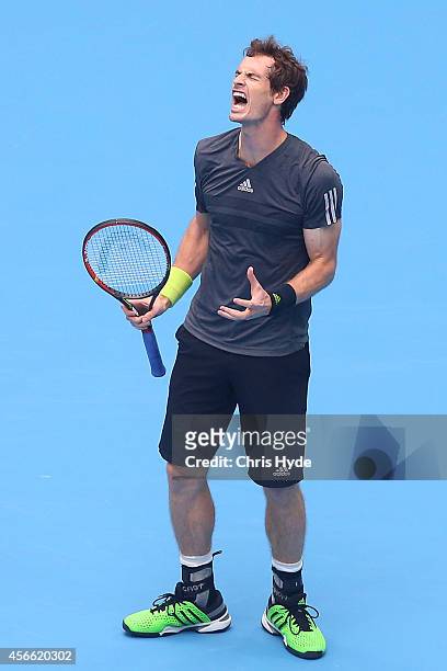 Andy Murray of Great Britain reacts after losing a point in his semifinal match against Novak Djokovic of Serbia during day eight of the China Open...