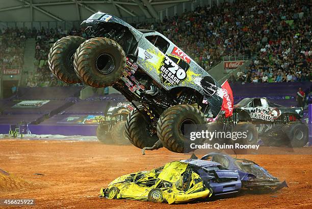 Marc McDonald driving Big Bash League jumps over cars during Monster Jam at AAMI Park on October 4, 2014 in Melbourne, Australia.