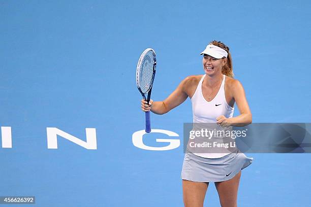 Maria Sharapova of Russia celebrates winning her match against Ana Ivanovic of Serbia during day eight of the China Open at the China National Tennis...