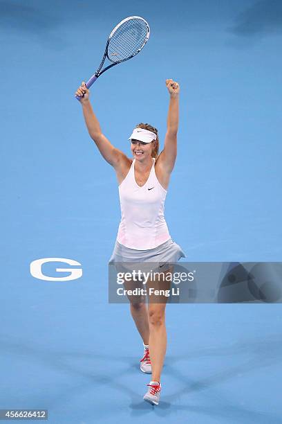 Maria Sharapova of Russia celebrates winning her match against Ana Ivanovic of Serbia during day eight of the China Open at the China National Tennis...