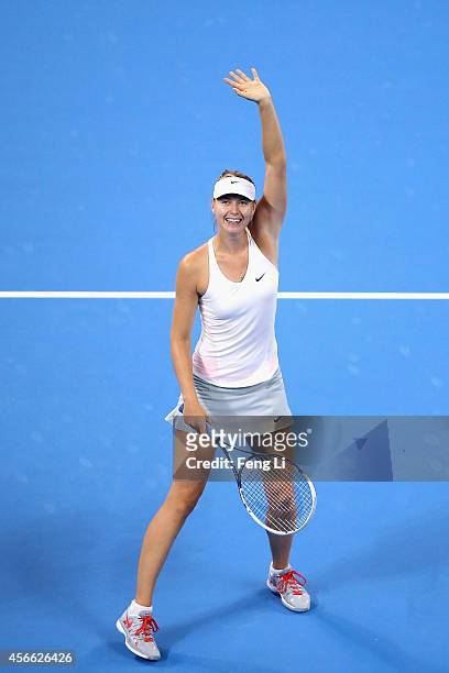Maria Sharapova of Russia celebrates winning her match against Ana Ivanovic of Serbia during day eight of the China Open at the China National Tennis...