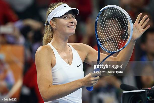 Maria Sharapova of Russia celebrates winning her match against Ana Ivanovic of Serbia during day eight of the China Open at the China National Tennis...