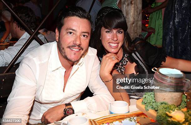 Rene Benko and his wife Nathalie Benko during Oktoberfest at Kaeferzelt/Theresienwiese on October 3, 2014 in Munich, Germany.