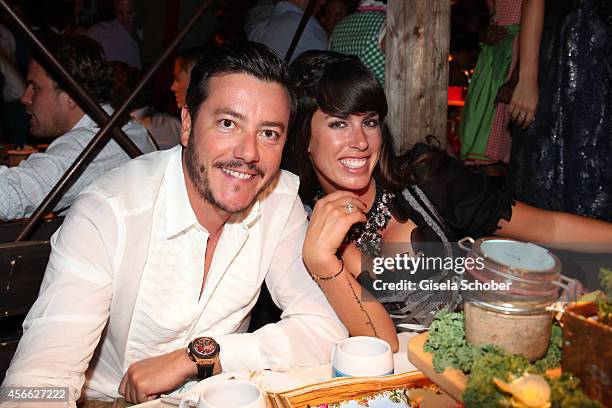 Rene Benko and his wife Nathalie Benko during Oktoberfest at Kaeferzelt/Theresienwiese on October 3, 2014 in Munich, Germany.