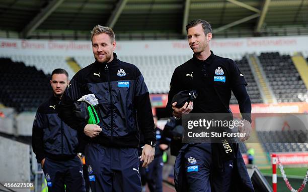 Newcastle United players from eft to right Adam Armstrong, Rob Elliott and Mike Williamson enter the stadium during the Barclays Premier League match...