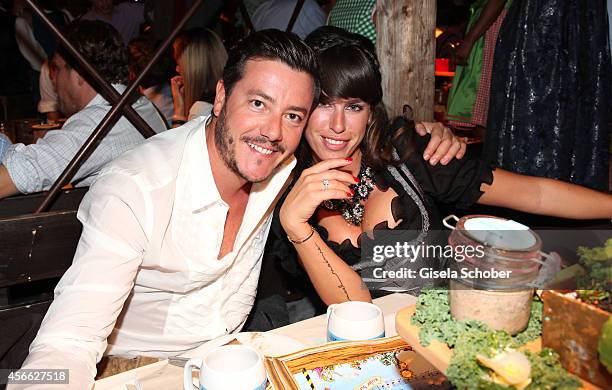 Rene Benko and his wife Nathalie Benko during Oktoberfest at Kaeferzelt/Theresienwiese on October 3, 2014 in Munich, Germany.