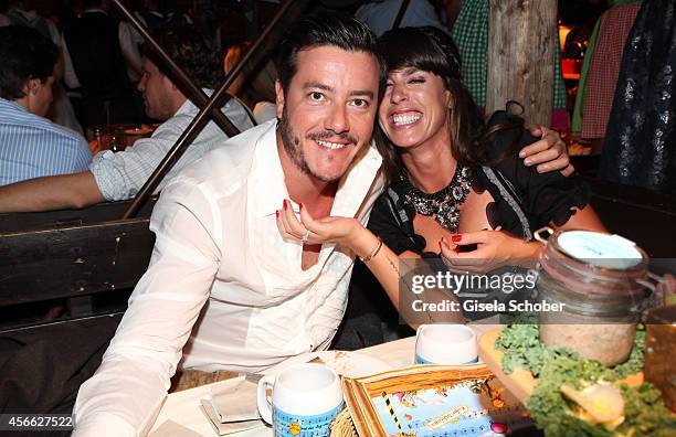 Rene Benko and his wife Nathalie Benko during Oktoberfest at Kaeferzelt/Theresienwiese on October 3, 2014 in Munich, Germany.