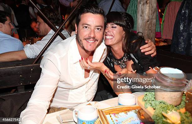 Rene Benko and his wife Nathalie Benko during Oktoberfest at Kaeferzelt/Theresienwiese on October 3, 2014 in Munich, Germany.