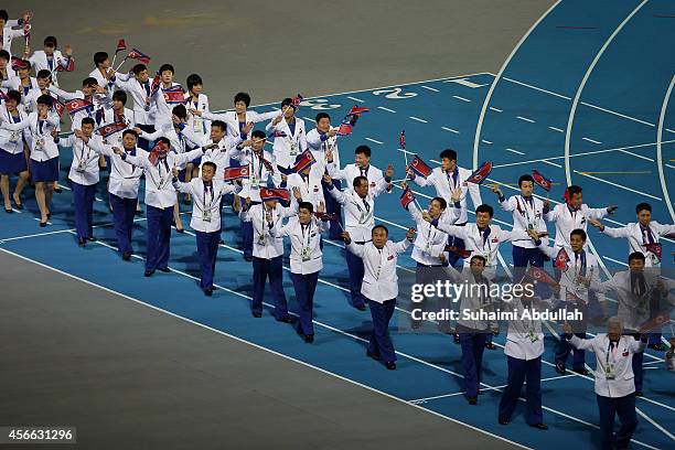 North Korea contingent enter the ground during the closing ceremony on day fifteen of the 2014 Asian Games at Incheon Asiad Main Stadium on October...