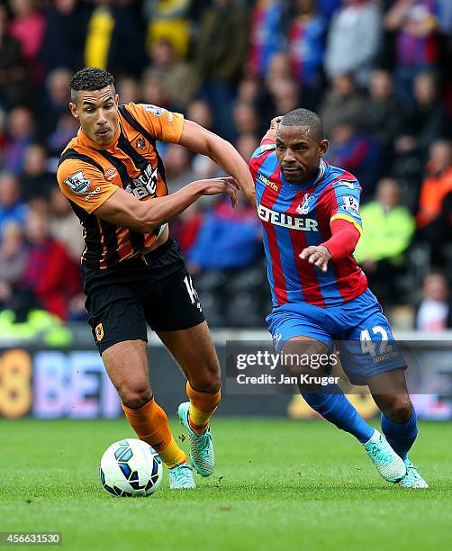 Jake Livermore of Hull City battles for the ball with Jason Puncheon of Crystal Palace during the Barclays Premier League match between Hull City and...