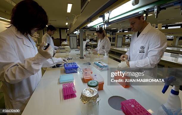 University professor Julieta Nafissi and students work in their scientists projects at the biotechnology lab of the UADE in Buenos Aires on September...