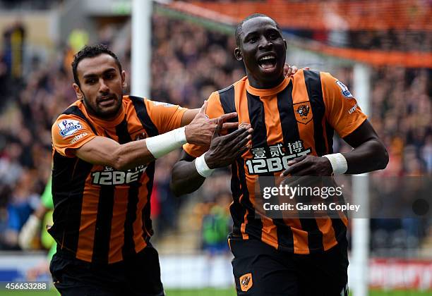 Mohamed Diame of Hull City celebrates with team-mate Ahmed Elmohamady after scoring the opening goal during the Barclays Premier League match between...