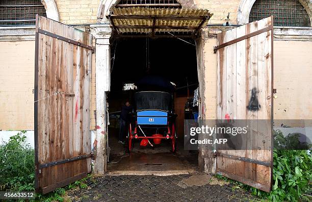 Angelo Sed, president of the Romans horse-drawn carriage drivers and his horse "Inventore" arrive at the stable after a day of work on October 2,...