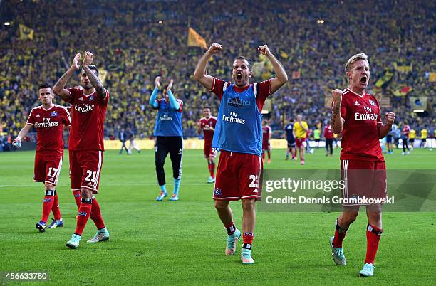 Hamburger SV players Lewis Holtby and Rafael van der Vaart celebrate victory after the Bundesliga match between Borussia Dortmund and Hamburger SV at...